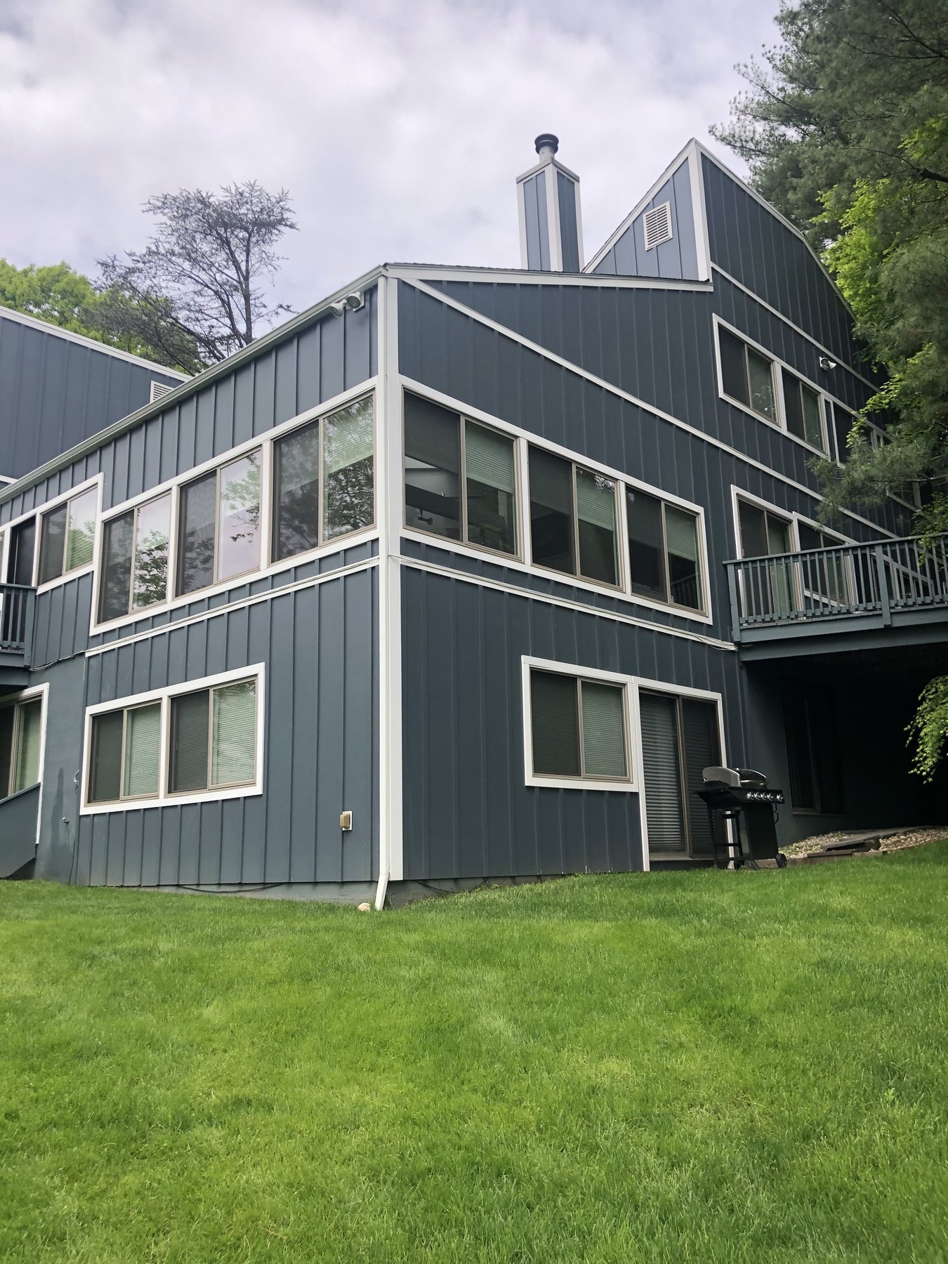 Two-story home with board-and-batten siding and white trim